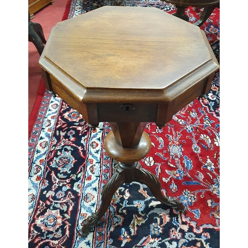 499 - A 19th Century Rosewood and Veneered Work Table on turned tripod supports and carved feet. W 43 x H ... 