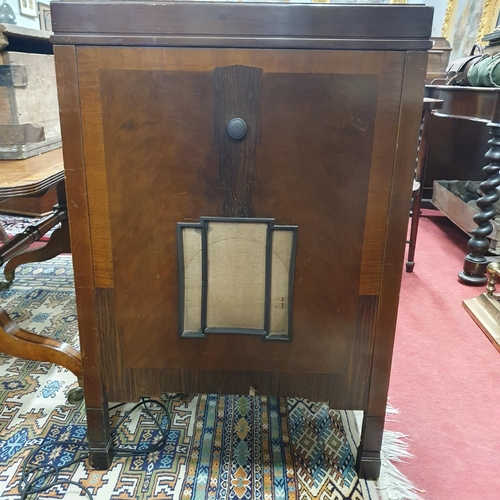 509 - A vintage Wooden cased His Masters Voice radiogram with a lift lid enclosing playing deck, to includ... 