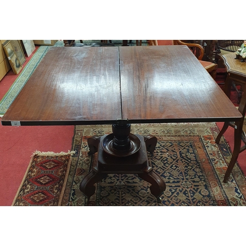 57 - A 19th Century Mahogany Foldover Tea Table on turned supports on unusual platform base. 99 x 94 x H ... 