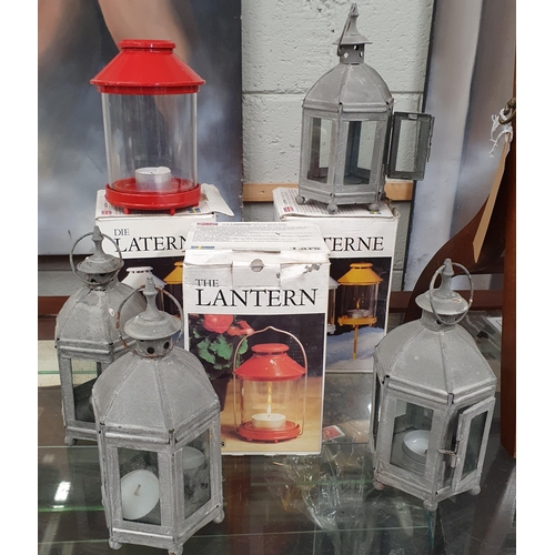 71 - A box of seven Garden Lanterns. #