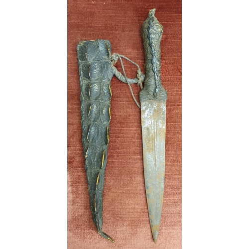 89 - An early medieval Dagger in a leather embossed scabbard. L 34 cm approx. #