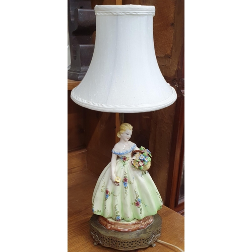 99 - A really good green glass Basket along with a Royal Doulton style table lamp.