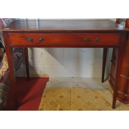 550 - A Georgian Mahogany Side Table with single drawer with swan neck handles raised on square tapered su... 