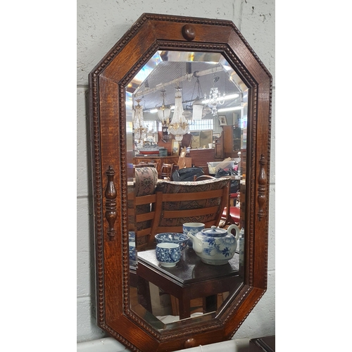 832 - A good early 20th Century Oak rectangular Mirror with canted corners and bevelled mirror glass. 43 x... 