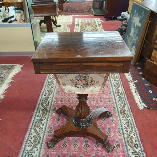 854 - A 19th Century Rosewood Work Table with fitted interior on bulbous tulip reeded support and platform... 