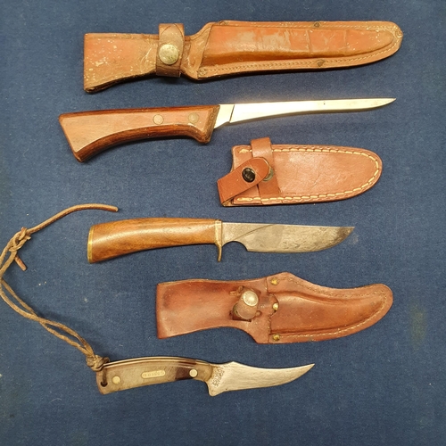 869 - A Western Fish Filet Knife, a Bohrann Knife and a Schrade Knife.