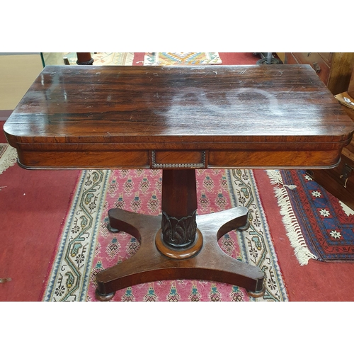 1107 - A 19th Century William IV Rosewood and Veneered foldover Card Table. Raised on quadruple base with o... 