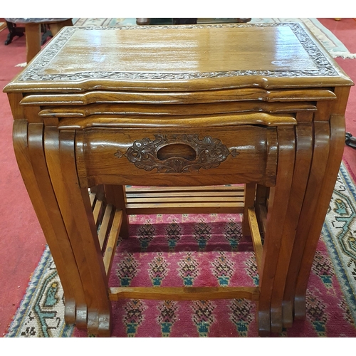 1122 - A really good Nest of four Oriental Hardwood Tables with highly carved outline. Largest being 53 x 3... 