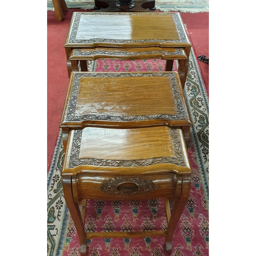 1122 - A really good Nest of four Oriental Hardwood Tables with highly carved outline. Largest being 53 x 3... 