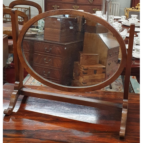 1123 - An early 20th Century Crutch Mirror of oval form. W 47 x H 42 cm approx.