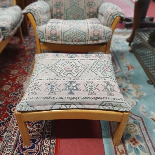 1127 - A good Ercol three seater Sofa along with an armchair and a pouffe. W 180 cm approx.