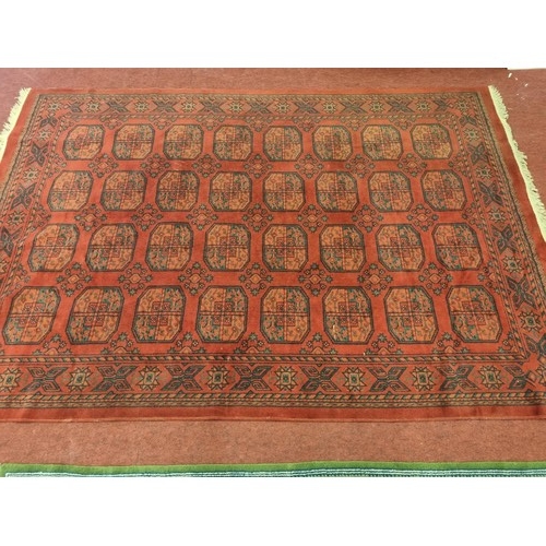 298 - A really good red ground Carpet with a unique repeating medallion design. 285 x 193 cm approx.