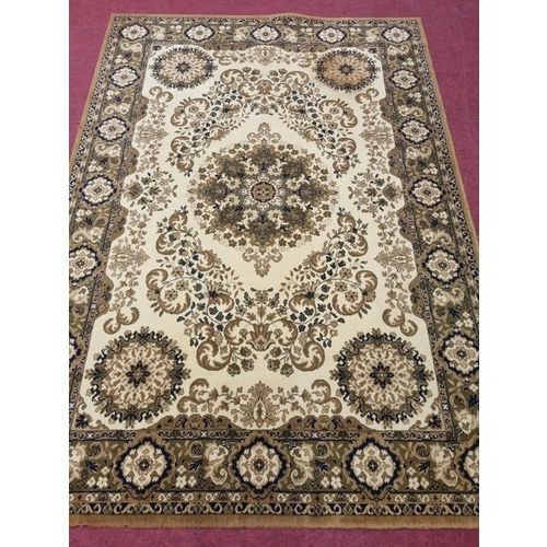 311 - A mustard and cream ground Carpet with multi borders and allover decoration. 287 x 203 cm approx.