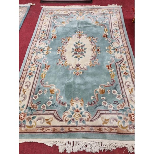 1110 - A good green ground Oriental Carpet with floral outline. 183 x 276 cm approx.