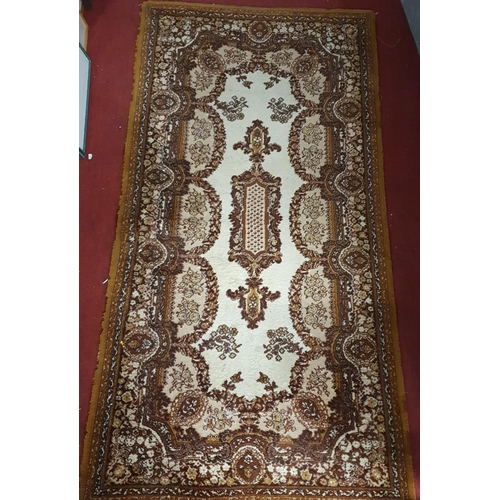 273 - A brown and cream ground Rug with multi borders and allover decoration. 180 x 91 cm approx.