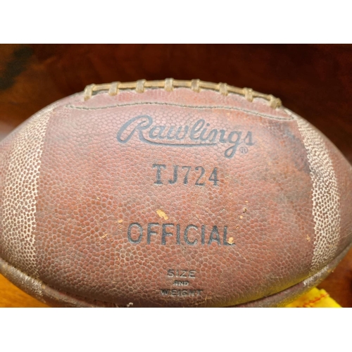 370 - A Vintage American Football, a set of Boules along with three coloured Prints.