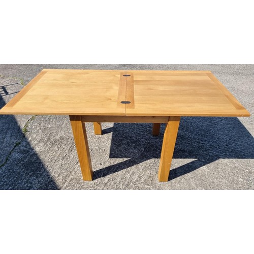 498A - A good Oak fold up dining Table.