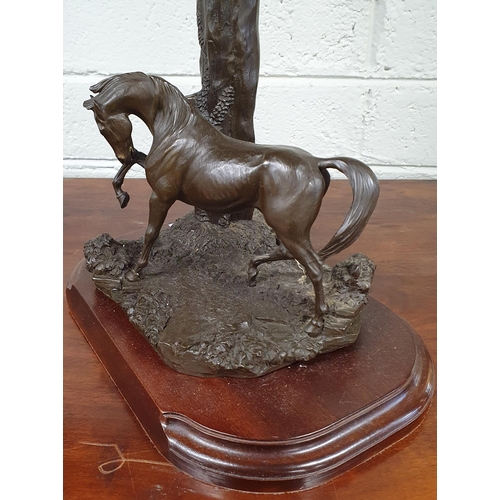 450A - A 20th Century Lamp in the form of a tree stump with figure of a horse. H 53 cm approx, along with a... 