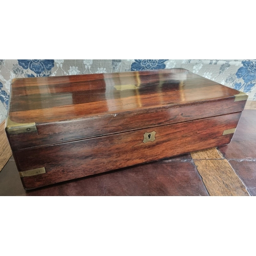 105 - A 19th Century Rosewood and Veneered Campaign Writing Slope.
45 x 24 x H 12 cm approx.