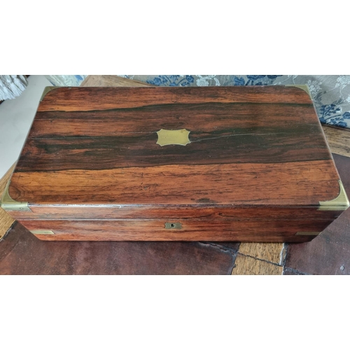 105 - A 19th Century Rosewood and Veneered Campaign Writing Slope.
45 x 24 x H 12 cm approx.