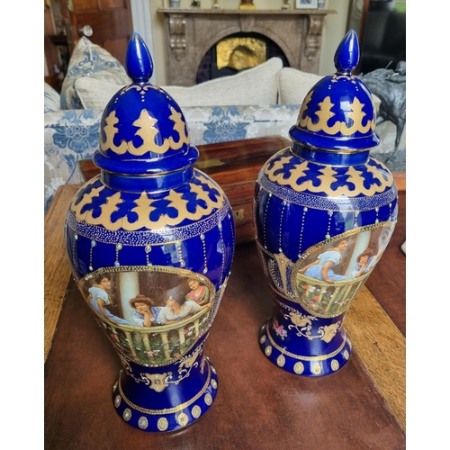 105A - A good pair of Blue ground Urns. H 37 cm approx.