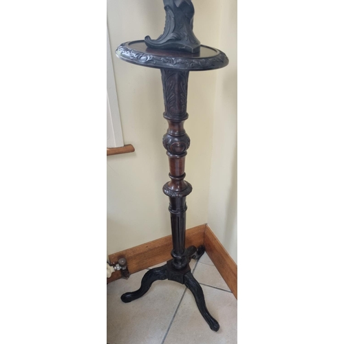 11 - A good 19th Century Mahogany Torchere Stand with highly carved outline. D 32 x H 118 cm approx.