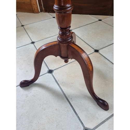 15 - An Edwardian Mahogany and Inlaid circular Supper Table with a shell inlay top, on turned tripod supp... 