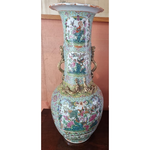 A Magnificent pair of early Oriental Urns of large size with hand painted decoration profusely decorated with dragons and Ho Ho birds of paradise. With dragon ring handles.
Top D 22 x H 65 cm approx.