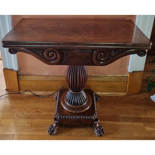35 - An early 19th Century Mahogany foldover Card Table, possibly Irish, with hairy paw feet turned reede... 