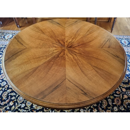 37 - A Magnificent 19th Century circular Centre Table with sunburst walnut veneered top on turned carved ... 