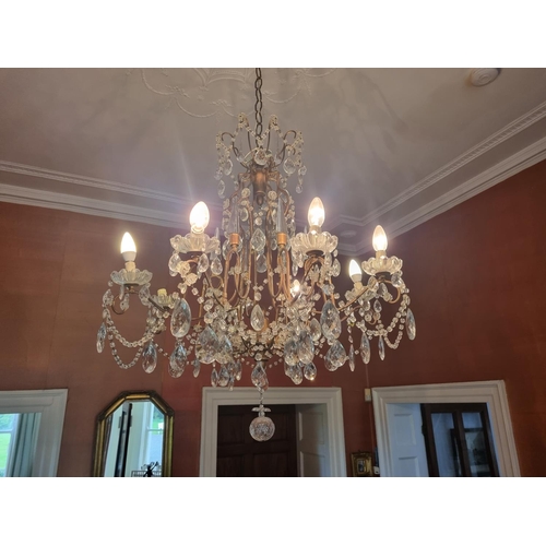 50 - A magnificent eight branch Crystal and metal Chandelier with crystal dops and swags.
W 68 x D 85 cm ... 