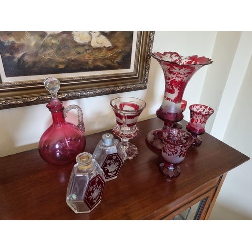 67 - A good quantity of 19th Century and later Cranberry Glass, consisting of a large vase (damaged) and ... 