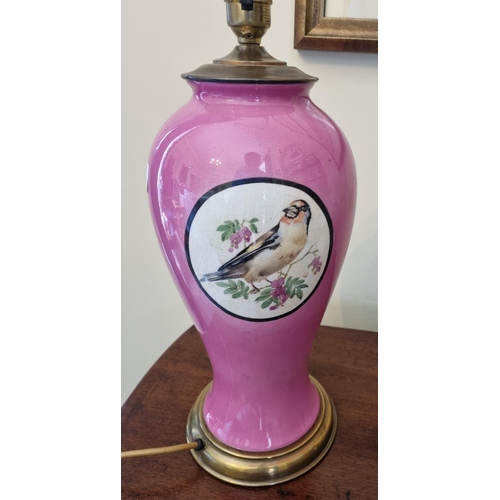 76 - A good pink ground Table Lamp and shade in tulip form decorated with birds. H 41  cm approx.