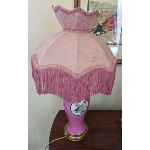 76 - A good pink ground Table Lamp and shade in tulip form decorated with birds. H 41  cm approx.