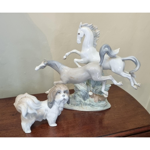 77 - A Lladro Figure of a group of horses in full gallop along with an early Lladro figure of a dog. (leg... 