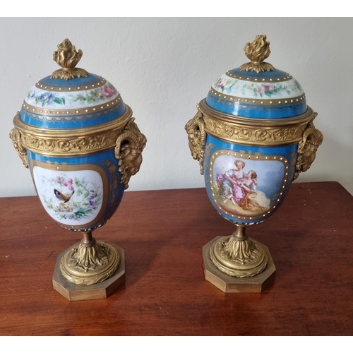 99 - A really good pair of 19th Century hand painted Urns with lids with ormolu rams head sides on plinth... 