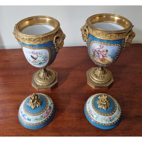 99 - A really good pair of 19th Century hand painted Urns with lids with ormolu rams head sides on plinth... 