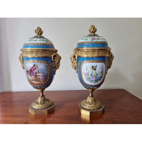 99 - A really good pair of 19th Century hand painted Urns with lids with ormolu rams head sides on plinth... 