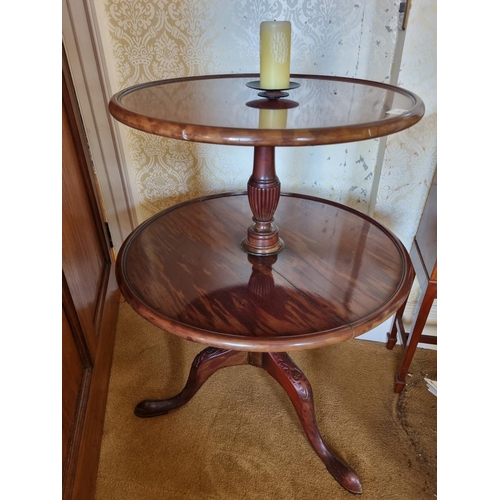 121 - A Georgian Mahogany two tiered Dumb Waiter with carved tripod base and turned reeded supports. Base ... 