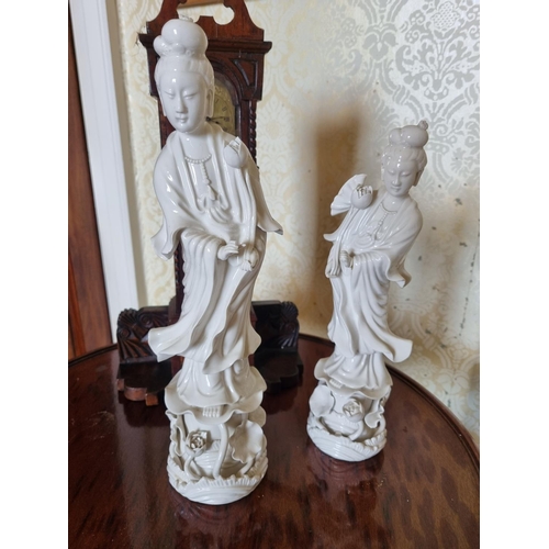 133 - A good large Oriental Blanc de Chine Porcelain Figure along with another. H 35 7 30 cm approx.