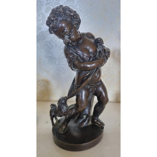 134 - A good well carved Bronze Figure of a young Child with a dog pulling at her skirt. No apparent signa... 