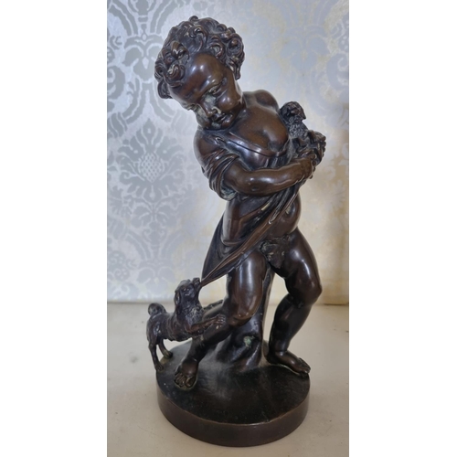 134 - A good well carved Bronze Figure of a young Child with a dog pulling at her skirt. No apparent signa... 