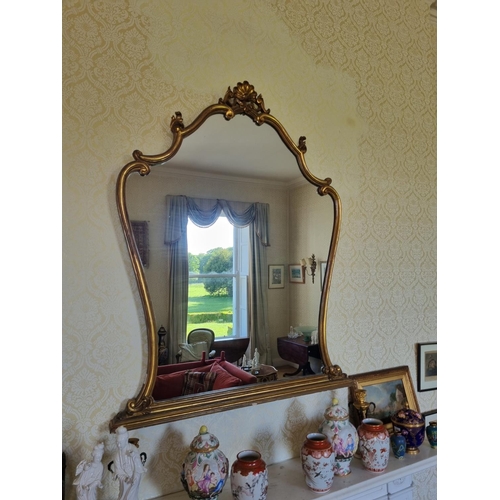 137 - A 20th Century Timber and Plaster Gilt Overmantel Mirror with cartouche carved top.
134 x 108 cm app... 