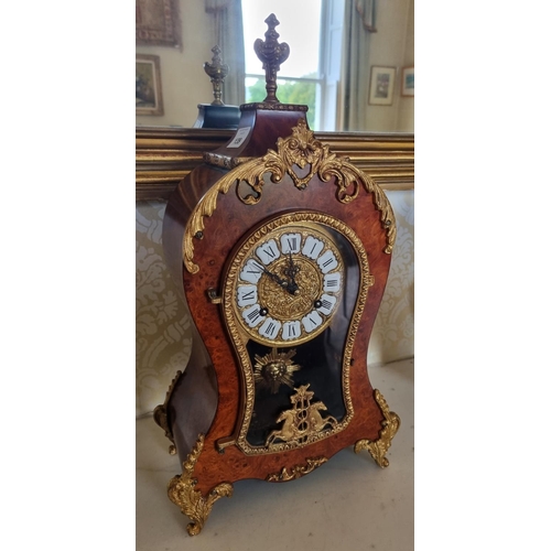 139 - A 20th Century Walnut and Burr Walnut Continental bracket Clock with ormolu mounts.
W 23 x D 12 x H ... 