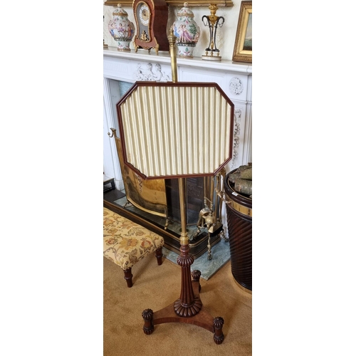 144 - Of Superb quality. An early 19th Century Pole Screen in the manner of Gillows, with a brass shaft on... 