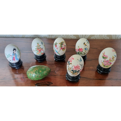 159 - A good group of five hand painted Oriental eggs along with another example.