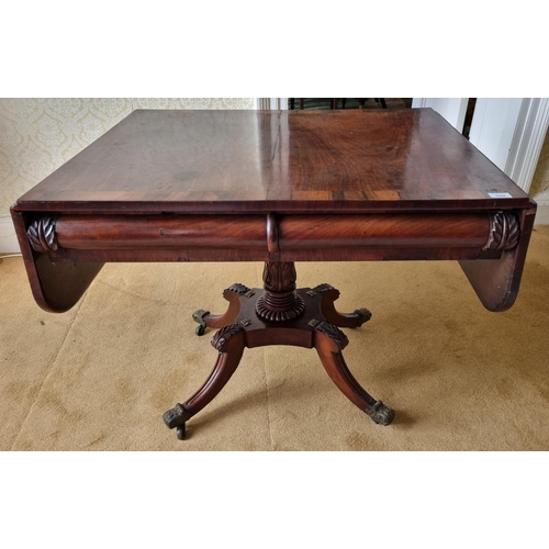 199 - A Magnificent Irish early Regency Mahogany Sofa Table with rosewood crossbanding and carved acanthus... 