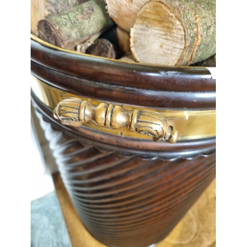 226 - A good Irish Peat/Log Bucket with brass rim reeded ribbed outline and two brass lifting handles.
D 5... 