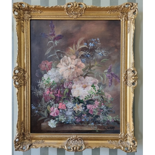 230 - An early 20th Century Oil on Canvas still life of flowers in a vase on a table setting. Signed C San... 