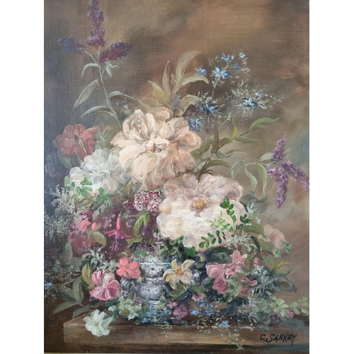 230 - An early 20th Century Oil on Canvas still life of flowers in a vase on a table setting. Signed C San... 